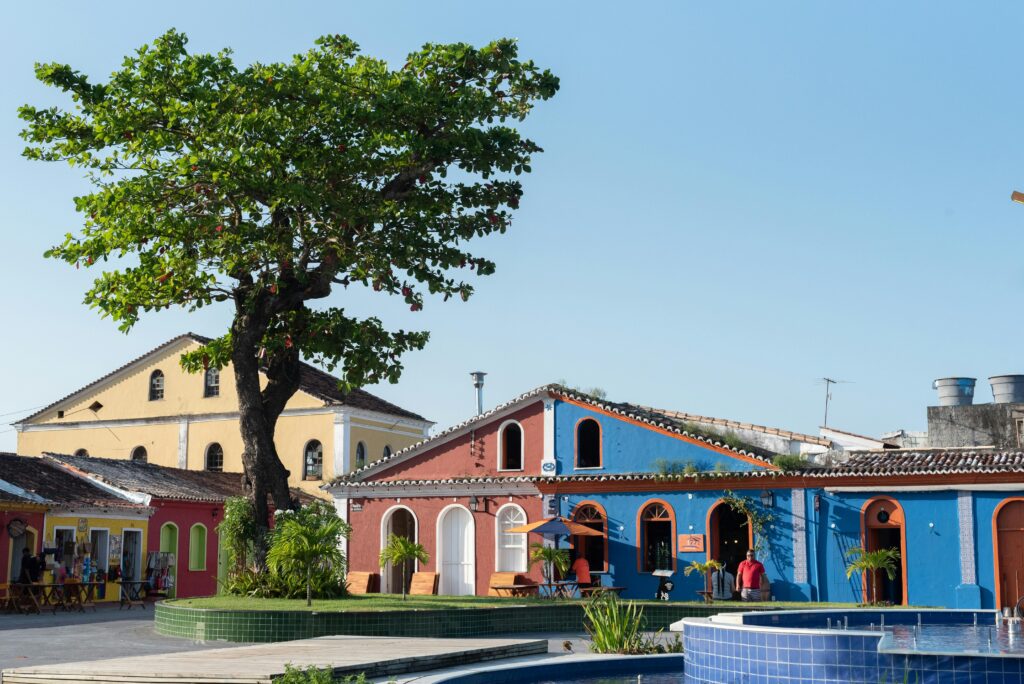 Vibrant colonial architecture under a clear sky in Porto Seguro, Brazil, showcasing cultural heritage.