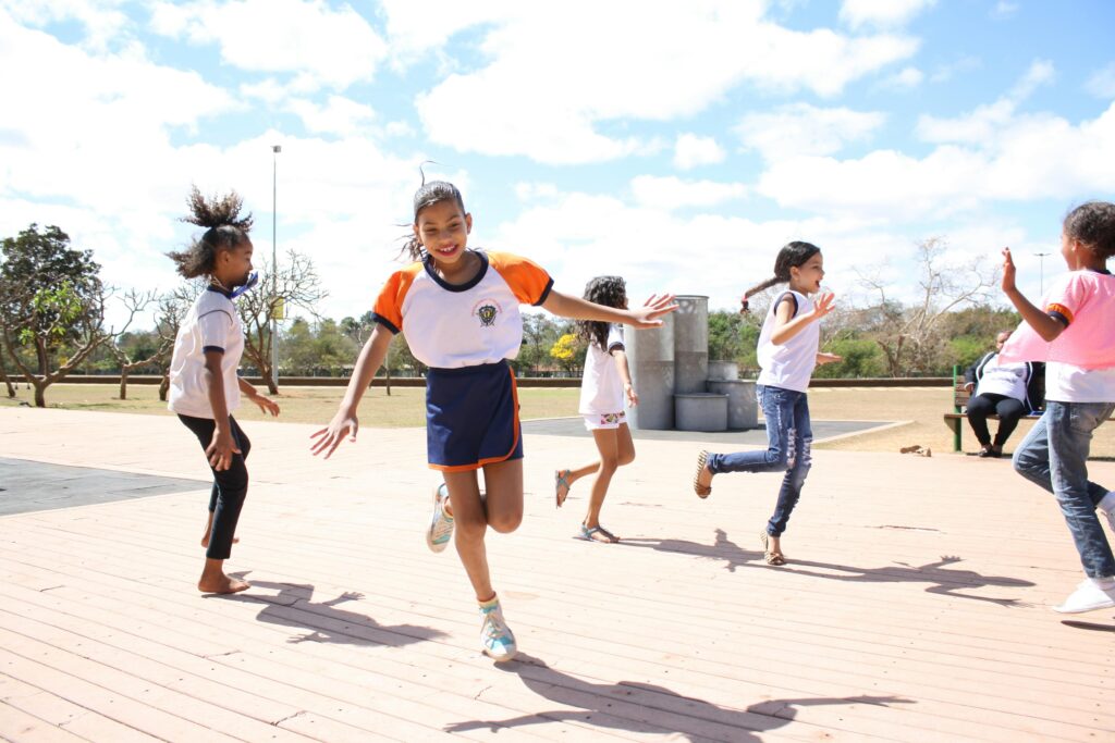 Group of children having fun outdoors in a park in Brasília, Brazil.